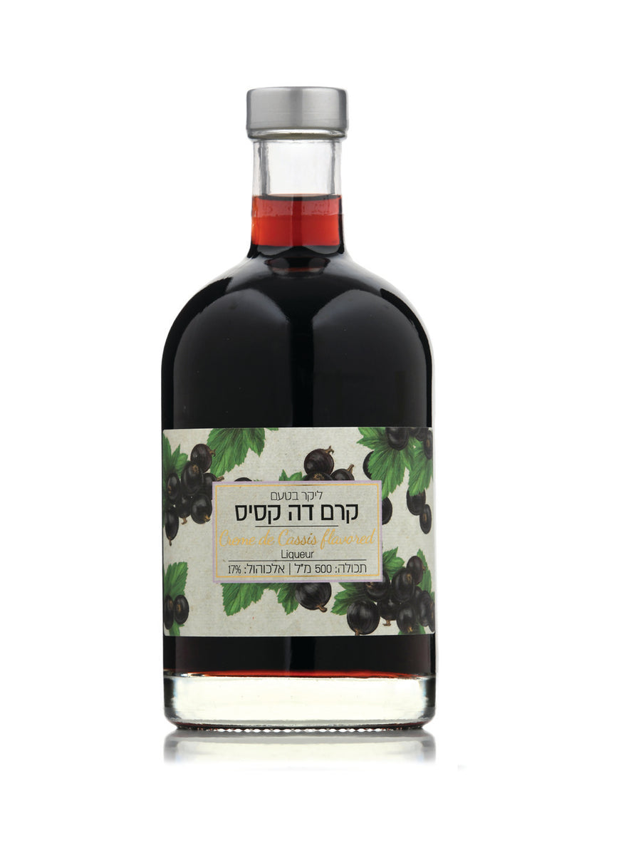 Bottle of Kedem black currant liqueur with a label on a white background