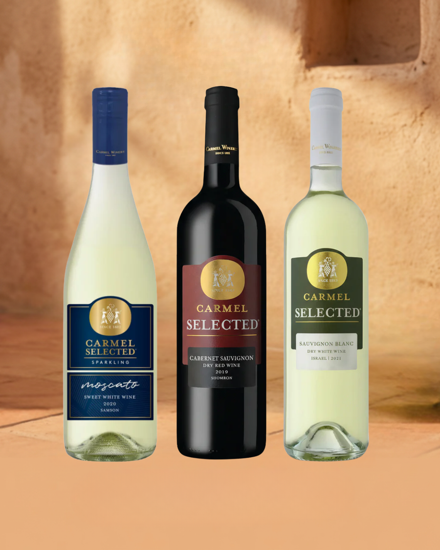 Three bottles of Carmel Selected wine on a warm-toned background
