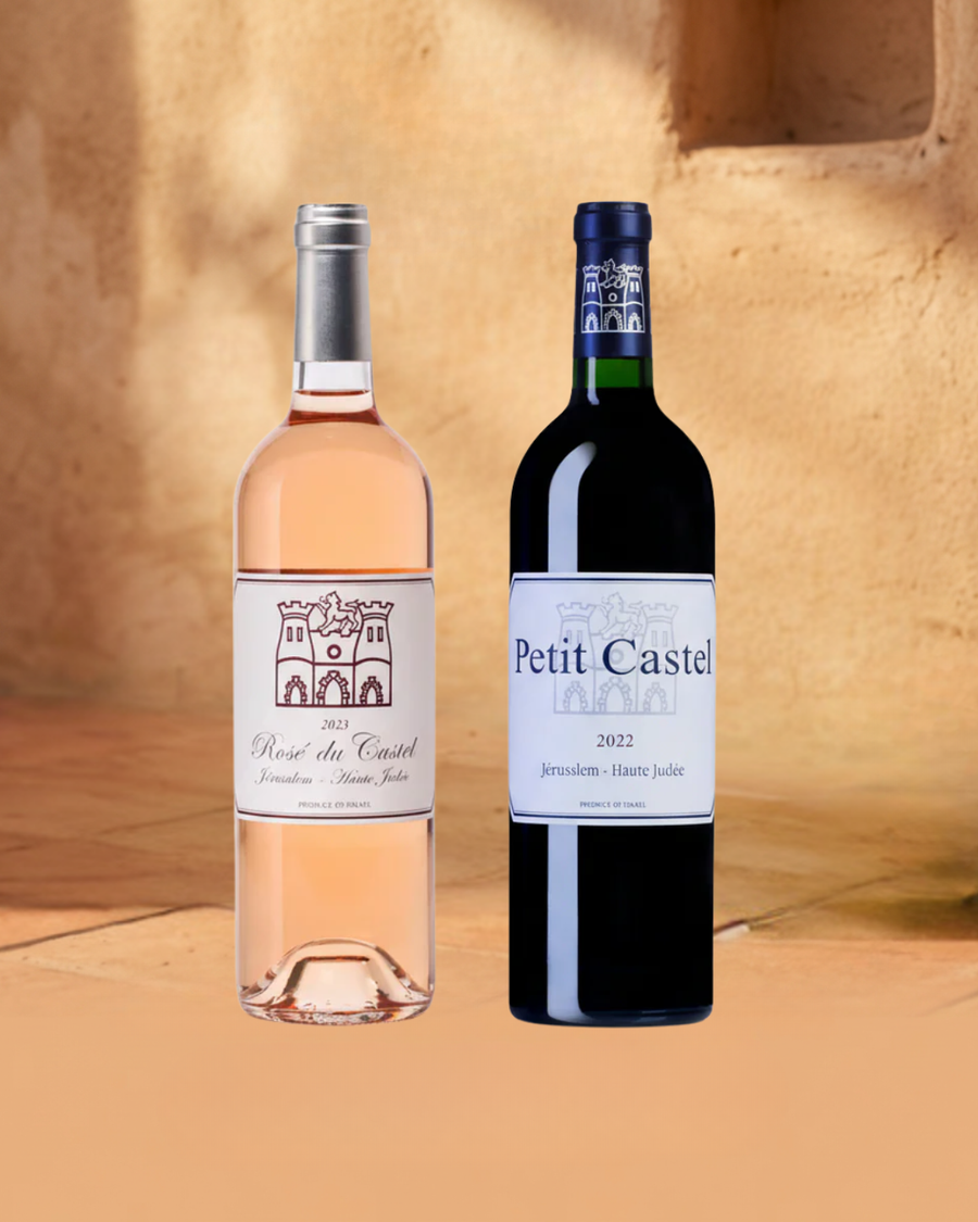 Two wine bottles, one pink and one red, with labels on a wooden background.